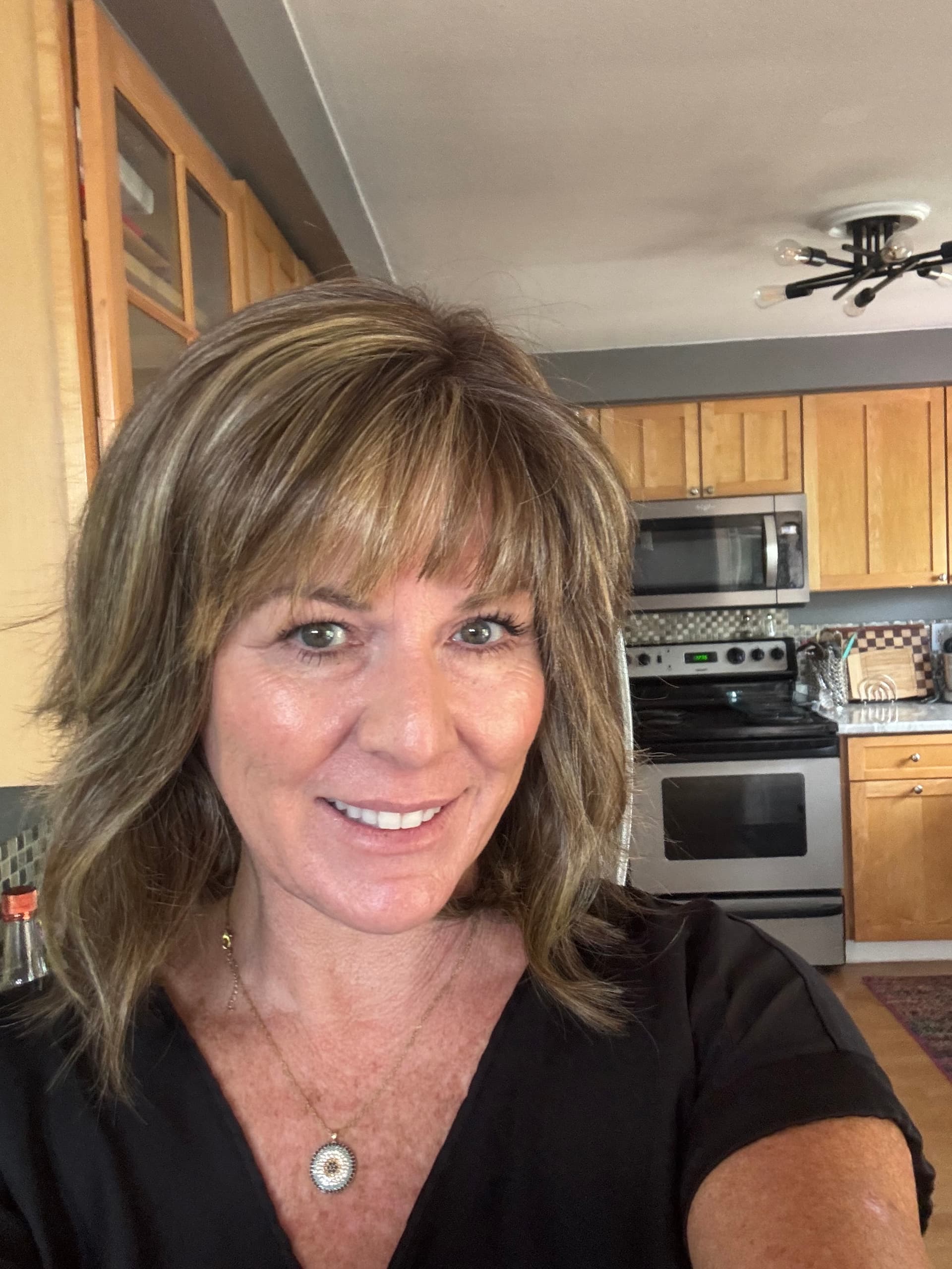 Raquel Welch brown blond bangs wavy