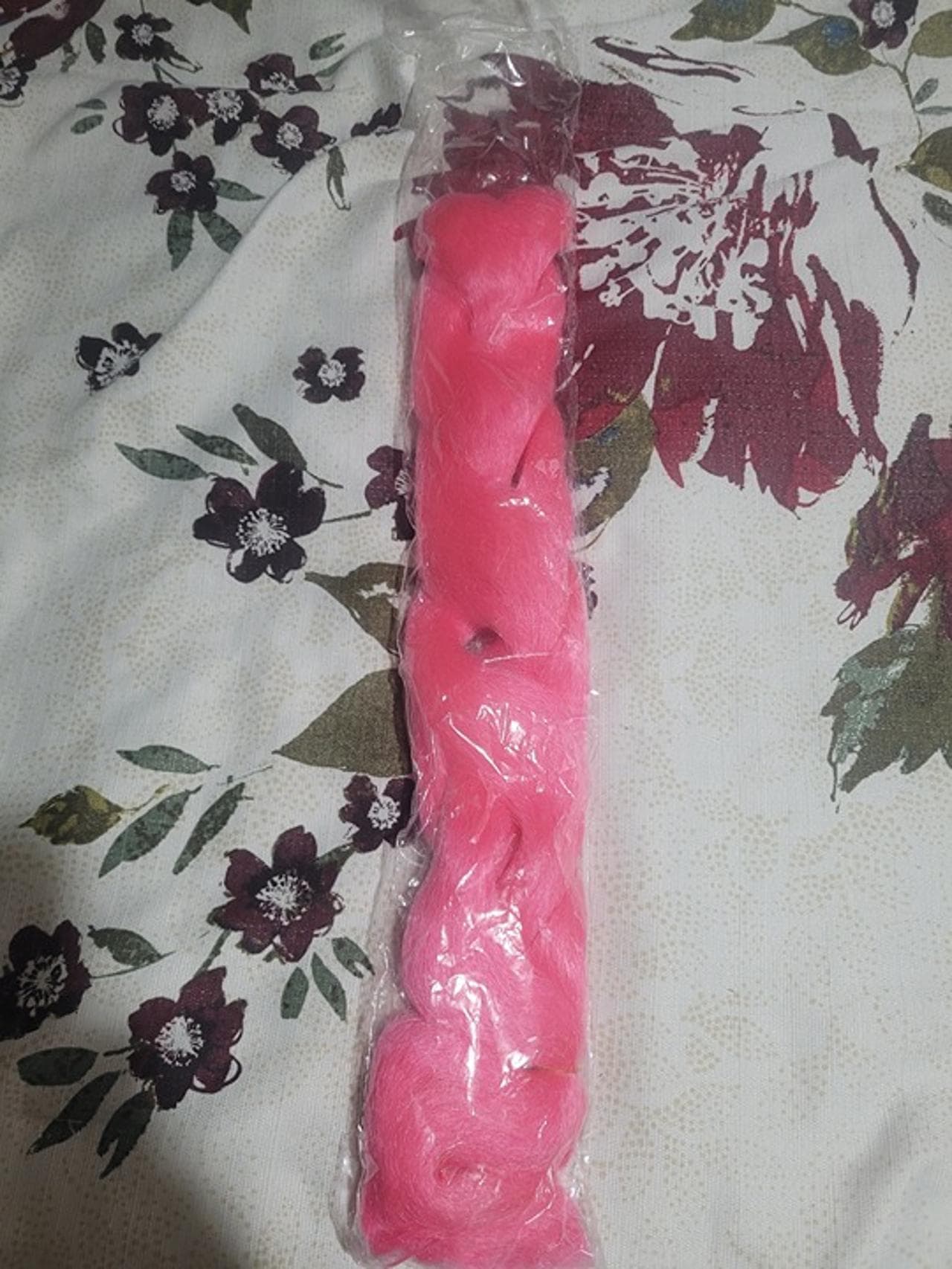 A hot pink synthetic hair braid