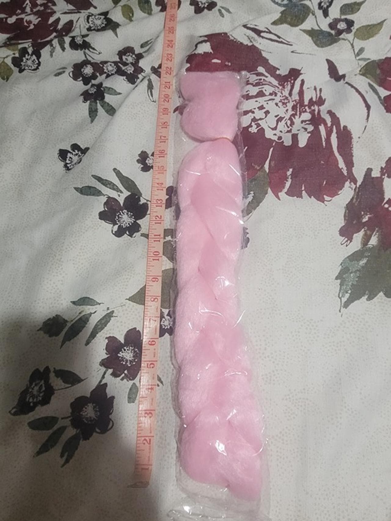 A light pink synthetic hair braid